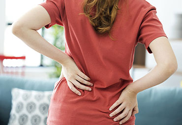 Woman with intense lower back pain