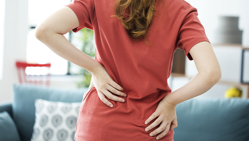 Woman with intense lower back pain