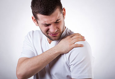 Man with frozen shoulder and shoulder pain