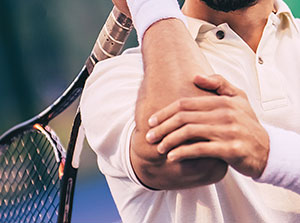 Man suffering with tennis elbow